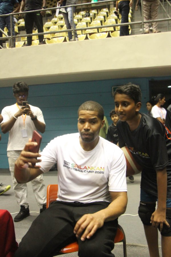 Coach JJ with a young player